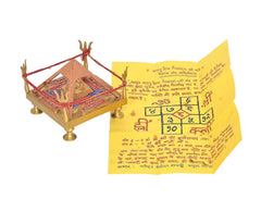 Brass Shri Yantra chowki with red threads, gold hand pillars, pyramid structure on square base