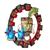 Front view Krishna flute wall hanging: gold face, green plume detail, blue hands