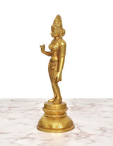 Golden brass Uma Parvati statue, side profile with raised hand and detailed long skirt