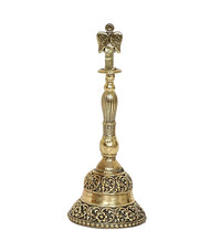 Brass pooja bell front view with patterned base and Garuda top