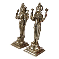 Brass Lakshmi and Vishnu standing showpieces holding symbolic staffs, on square bases