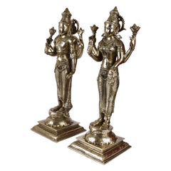 Brass Lakshmi and Vishnu standing showpieces holding symbolic staffs, on square bases