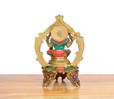 Back view Lakshmi brass idol, teal outfit, multicolor beaded border, round back disc