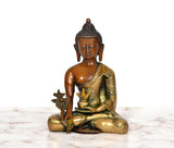 Brass Buddha statue seated in Varada mudra, multicolor finish and ornate detailing