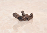Copper Vishnu-Lakshmi idol on Sheshnag serpent, side view with raised crown