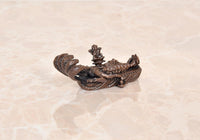 Copper Vishnu-Lakshmi idol on Sheshnag serpent, side view with raised crown