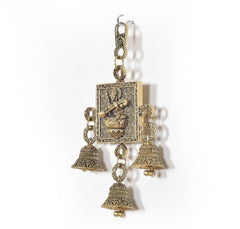 Brass Saraswati wall hanging shown in side angle with square plaque and three bells