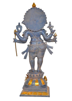 Rear view of brass six-armed Ganesha statue, detailed back and gold ornaments