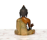 Rear view: multicolor brass Buddha statue seated, Varada mudra hand offering gesture