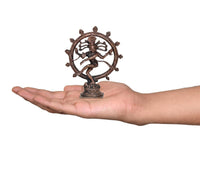 Copper Nataraja Shiva idol on palm for size, dancing figure with circular halo