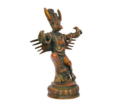 Brass Garun Bhagwan idol, angled view, extended arms and detailed jewelry