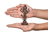 Shree Kal Bhairav copper idol held in hands, showing compact 5.5 inch height