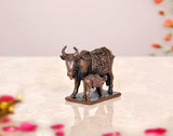 Copper cow and calf pooja mandir figurine, rear angle, patterned cloth texture