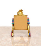 Back view: brass Ganesha statue on chair, reading, solid square seat back