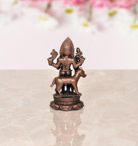Copper Kal Bhairav idol, back view, trident and small hand-held ornaments