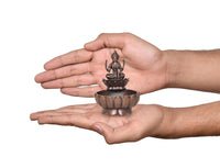 AONA copper Lakshmi Maa urli bowl, 3-inch height, shown in hands; goddess on lotus base.
