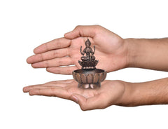 AONA copper Lakshmi Maa urli bowl, 3-inch height, shown in hands; goddess on lotus base.