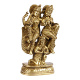 Brass Lakshmi and Vishnu on Garuda idol with small seated figure, side view