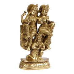 Brass Lakshmi and Vishnu on Garuda idol with small seated figure, side view