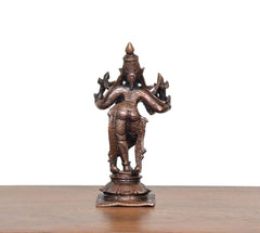 Rear view of copper-bronze Krishna playing flute statue on square base