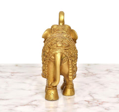 Brass elephant figurine back view, detailed embossed designs on the body