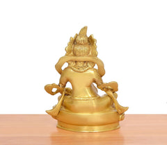 Golden Kuber Bhagwan brass murti, back view, hands around and textured torso