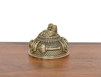 Angled brass Hanuman Charan Paduka idol with textured surface and stacked top posts