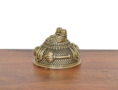 Angled brass Hanuman Charan Paduka idol with textured surface and stacked top posts