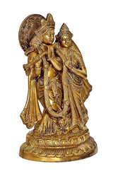 Brass Radha Krishna idol, close-up angle with garlands and detailed facial features