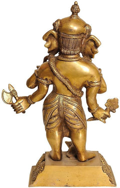 Brass standing Ganesha figurine, side view showing detailed back, skirt, and trunk