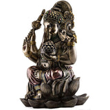 Ganesha resin statue from side, seated with trunk forward and jeweled hands