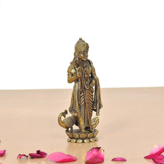 Standing brass Kartikeya murti side view, ornate draped garment and lotus base