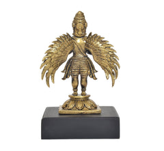 Garuda deity statue with wings outstretched, gold-tone finish on dark base