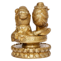Brass Shiv Parvati bust idol, back/side view showing hair detailing and engraved base