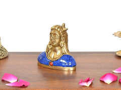 Brass Adiyogi Shiva idol in profile, blue torso with red pendant, gold base