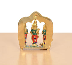 Ram Darbar idol angled view, central figure framed by a golden arched backdrop