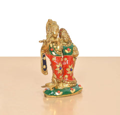 Brass Radha-Krishna idol in standing pose, ornate red, green, and gold jewelry