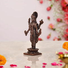 Copper Dhanvantari statue, three-quarter view from back, detailed robe, lotus base