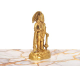 Brass Hanuman Ji idol, profile view holding a staff with detailed armor
