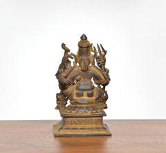 Copper Shiv Parivar statue, back view, trident-like details and textured clothing