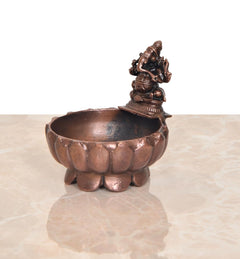 Copper Ganesha urli bowl, side view showing legs and basin rim