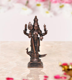 Copper standing Kartikeya Murugan idol, detailed four-armed pose on square base