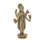 Brass Dhanvantri 6-inch statue, three-quarter view, crown, trident-like symbols, lotus pedestal