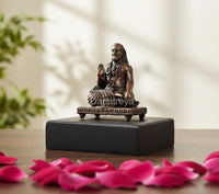 Copper Raghavendra Swami idol statue, seated guru with raised hand on dark base