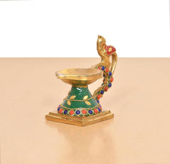Brass peacock diya rear view, multicolor enamel trim and lamp bowl