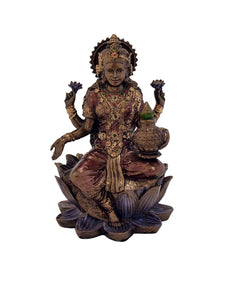 Polyresin Lakshmi statue, seated on lotus, holding a pot, 3 in height