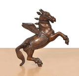 Brass flying horse with wings, angled view, detailed head and wing feathers