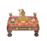 Brass Lord Shiva figurine on rectangular chowki base with red rope edge details