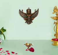 Brass Garuda deity hanging decor, winged figure with ornate face, 5 inch height