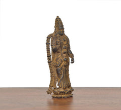 Copper Meenakshi idol, side view with draped lower garment and beaded ornaments